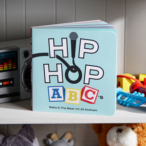 Rapper ABC Book on a shelf with kids' toys